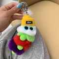 Cute caterpillar plush keychain with yellow knit hat and blue sunglasses on green fur ball - White Green Red Purple