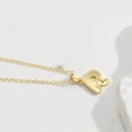 Minimalist gold necklace featuring letter P pendant with unique honeycomb texture detail - Letter R