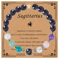 Detailed Sagittarius beaded bracelet featuring blue goldstone and gold star pendant on card - Sagittarius