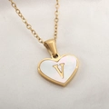 Golden heart necklace with white shell inlay featuring a central letter V pendant - Letter V