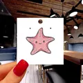 Cute pink starfish enamel pin with cartoon face on a white display card for accessories - 146*Cute Pink Starfish Pin