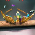 Macro shot of handmade gold crystal headband with iridescent pillars on a wood branch - Multicolor Crystal + Gold Wings