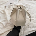White minimalist geometric folding bucket bag with architectural origami design - White