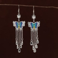 Ethnic silver-finish butterfly tassel earrings with colorful enamel and floral accents - Enamel Accented Butterfly Tassel Style (E6122-2)