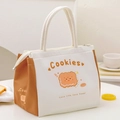 Geïsoleerde canvas lunchtas in beige en bruin met koekjesprint en ritssluiting - Sandwich Koekje