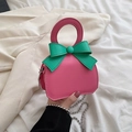 Pink mini leather crossbody bag with a green oversized bow and silver ball chain - Pink