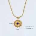 Detail of 14K gold starburst pendant necklace with blue eye bead and textured chain - Evil Eye Lapis Lazuli