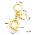 Golden letter Q alphabet keychain with lobster clasp and dimension labels in 42mm size - Letter Q