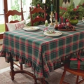 Detail of red and green plaid tablecloth featuring ruffled edges and festive Christmas decor - Christmas Green Grid Ruffle