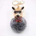 French Bulldog keychain with gold metallic head, sunglasses, and fluffy grey faux fur pom pom - Two-tone Black