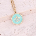 Macro detail of gold stainless steel pendant with light blue enamel and fleur-de-lis pattern - Light Blue Fleur-de-lis Style (4#)