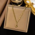 Detail view of gold-plated titanium steel necklace with asymmetrical chains and bead - Lucky Ball Asymmetric Necklace Gold