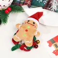 Detailed close-up of a Christmas gingerbread man scrunchie with cute festive bells - Woven Gingerbread Man Hair Tie With Bell