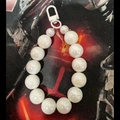Handmade beaded keychain featuring iridescent white faux pearls and a round spring clasp - Iridescent White