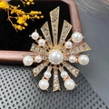 Macro detail of vintage starburst brooch with crystals and pearls on velvet - BZ007 Retro Starburst