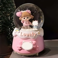 Pink musical snow globe featuring a girl and cat figurine with a Lovely embossed base - 2524 Pink Base / Medium 80mm Light + Music