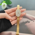 Elegant gold vintage quartz watch with oval case and white dial on a woman's wrist - Watch Only / Gold