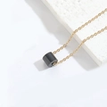 Minimalist golden chain necklace with sleek black cylindrical pendant on white base - Black Cylinder / Black / Gold Chain