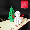 3D pop-up Christmas card featuring snowman and tree with a red envelope, 15x15cm - Snowman and Tree