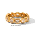 Close-up of gold eternity ring with circular zircons, measuring 0.55cm in width - Number 6 / Round Style (HC-R30605)