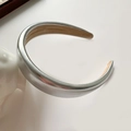 Close-up of padded silver PU leather headband with metallic laser finish and soft lining - Plain Headband