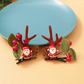 Christmas hair clips with red Santa figures, reindeer antlers and festive berries - Christmas Clip Style 3