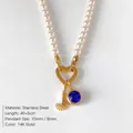 Elegant pearl necklace featuring 14K gold J letter charm and blue crystal pendant variant - Letter J