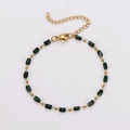 Detail of green emerald-cut beads and golden spacers on a stainless steel bracelet - Rectangular Dark Green
