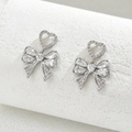 Detailed view of silver bow earrings with sparkling heart-shaped zircon inlay stones - Silver Heart Pendant Style (EH4586-6)