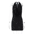 Dettaglio di mini abito nero all'americana con decorazioni di perle a goccia e trasparenze - S / Nero