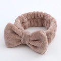 Soft lotus pink coral fleece headband with a large bow for face washing and skincare - Brown