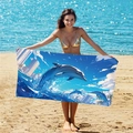 Blue microfiber beach towel featuring a dolphin and city silhouette illustration - B73-Dolphin Leaping