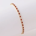 Detail of adjustable tennis bracelet with red and clear stones in claw setting - Gold White Zircon + Bright Red