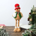 Detail of extendable gingerbread man doll with knitted vest on wooden table setup - Gingerbread Man Stretchable Doll Male