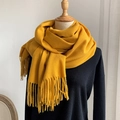 Ginger yellow faux cashmere scarf with tassels shown on a wooden mannequin display - Ginger Yellow
