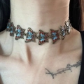 Y2K butterfly choker with red and blue enamel wings on a crystal pearl necklace - Mechanical Butterfly Enamel Choker