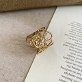 Detailed macro view of the gold hollow geometric intertwined rings with textured finish - No.2 Ring-Gold-Circle