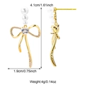 Golden bow earrings with white pearls and sparkling zircons, size 4.1cm by 1.9cm - Triple Pearl Bow Style (E01247G)