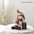 Christmas resin girl figurine with gold star lamp and snowy base, size 12.7cm tall - Sitting Girl with Star