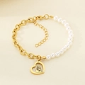 Detail of gold chain and pearl bracelet with heart-shaped mother and child pendant - Heart Mother And Child Hug (KB203714-Z)
