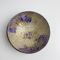Handcrafted coconut shell bowl with vibrant gold and purple mosaic inner lining - Purple Pomegranate Style