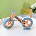 Miniature balance bike keychain toy model with light orange frame and blue tires - Bicycle Keychain - Blue