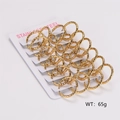 Macro view of 12 pairs of hammered gold stainless steel hoop earrings on display card - Hammered Texture 2.5mm Diameter 20mm Inner Diameter