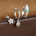 Macro detail of silver snake-shaped earring set with green crystals and floral studs - 混搭组合(Y26055) / 银色-白-绿