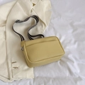 Minimalist mustard yellow crossbody bag with a striped woven wide shoulder strap - Yellow