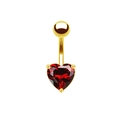 Macro view of golden navel piercing with a finely cut red heart-shaped gemstone detail - Gold/Heart/Red