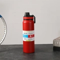 Red stainless steel vacuum sports bottle with black lid and portable handle - Red