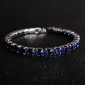Macro shot of silver tennis bracelet featuring square-cut deep blue zircons in 4-claw setting - 4mm-19cm / Navy Blue Zirconia
