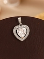 Macro shot of silver heart pendant with brilliant faceted cubic zirconia stones - Silver White Zircon