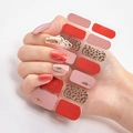 Leopard print and red strawberry nail wraps with gold feather details on a hand - DQ-12 Leopard Red